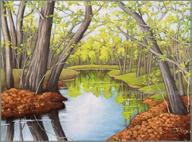 Spring landscape with creek trees and reflection