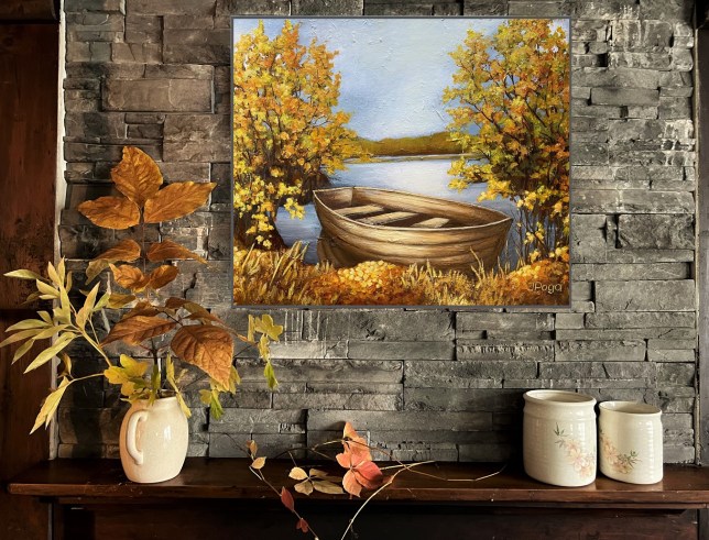 Sunset boat painting on studio wall